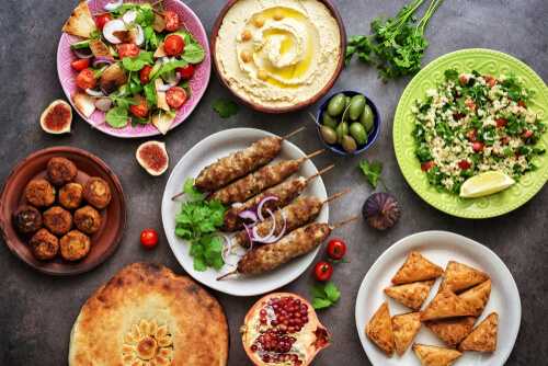 A wide variety of food placed on a table - Halal Restaurants in Nottingham 