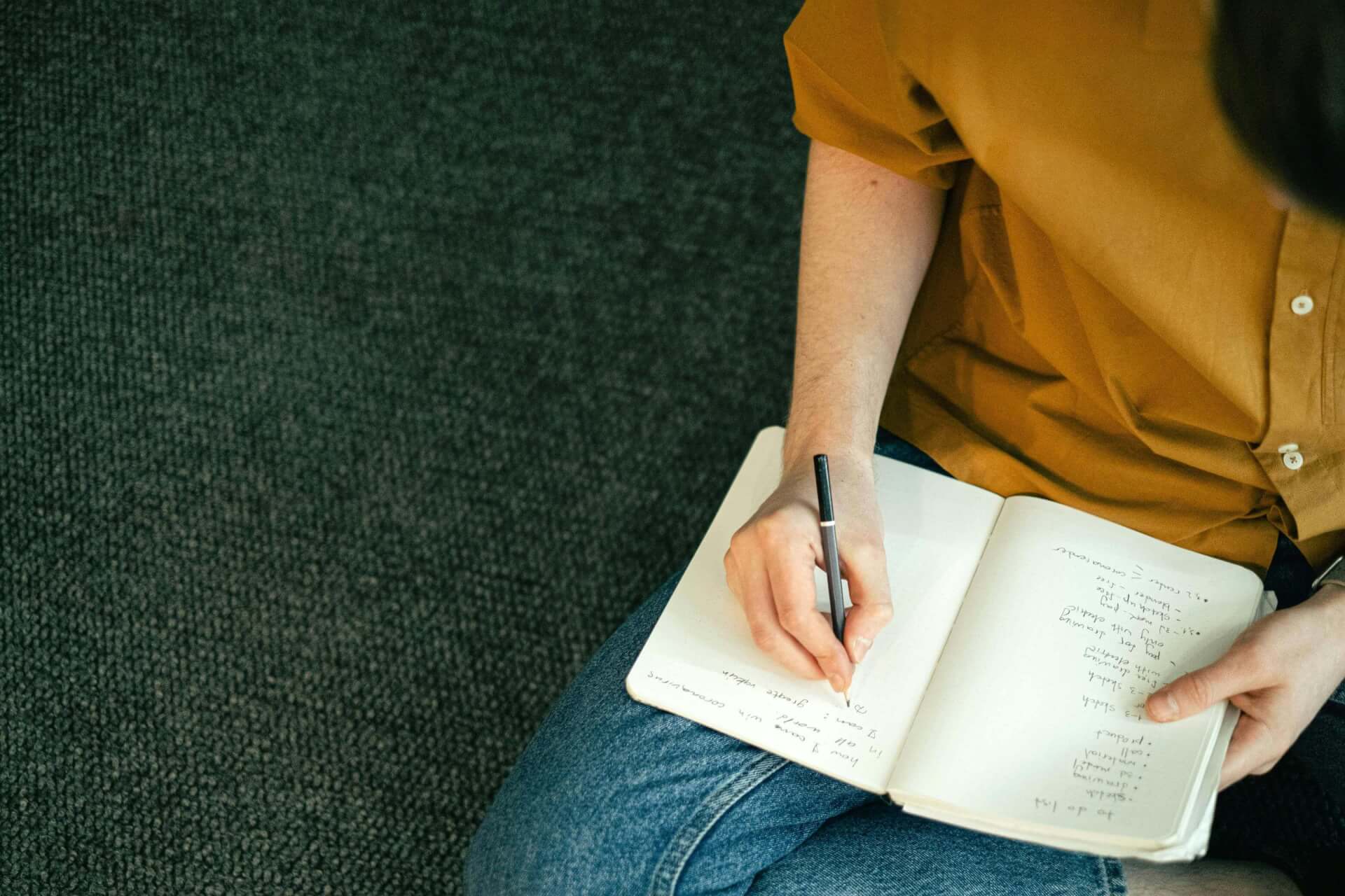 Person taking notes during an open day 