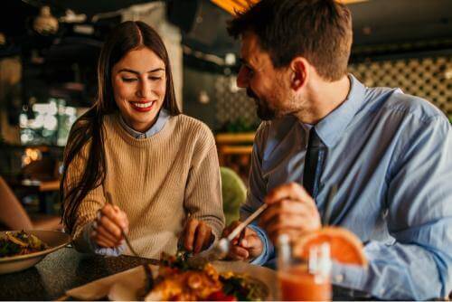 2 people eating in a restaurant 