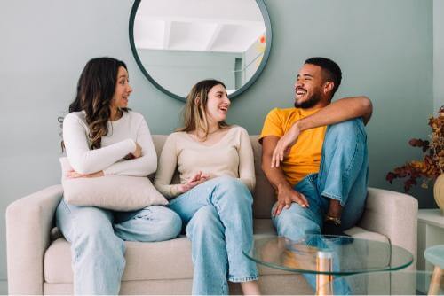 3 students laughing and talking