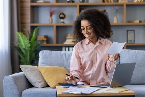 Girl writing a student budget 