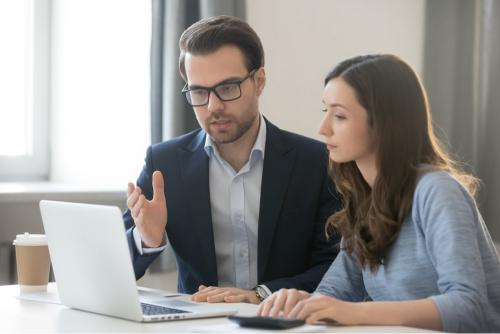 Girl at an internship talking to her boss 