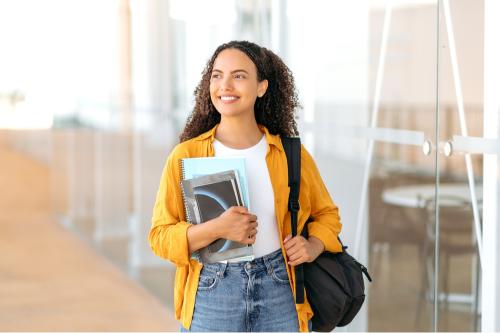 Girl holding a bag and books 