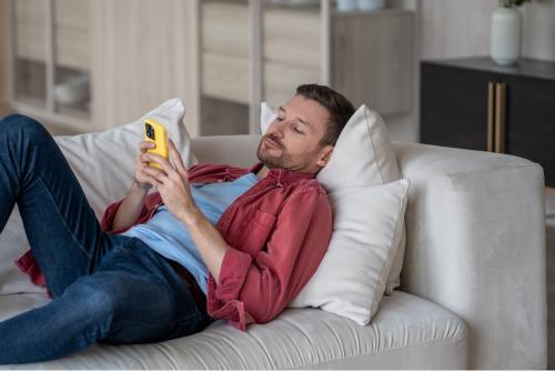 Man on sofa on the phone