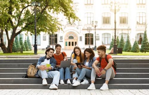 students sitting on campus 