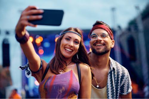 people taking photos at festival
